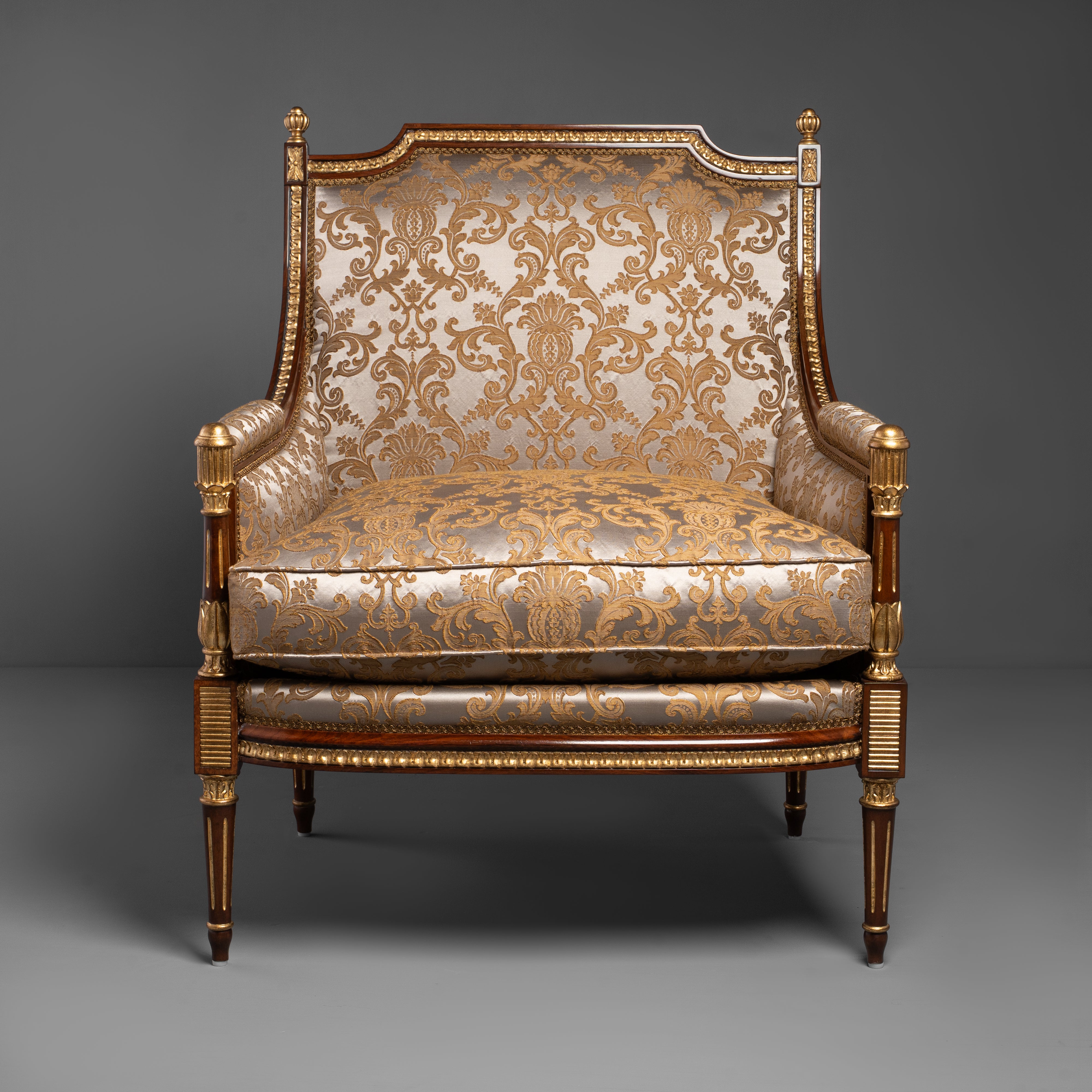 Hand-Carved Louis XVI Style Armchair with Ornate Brass Motifs