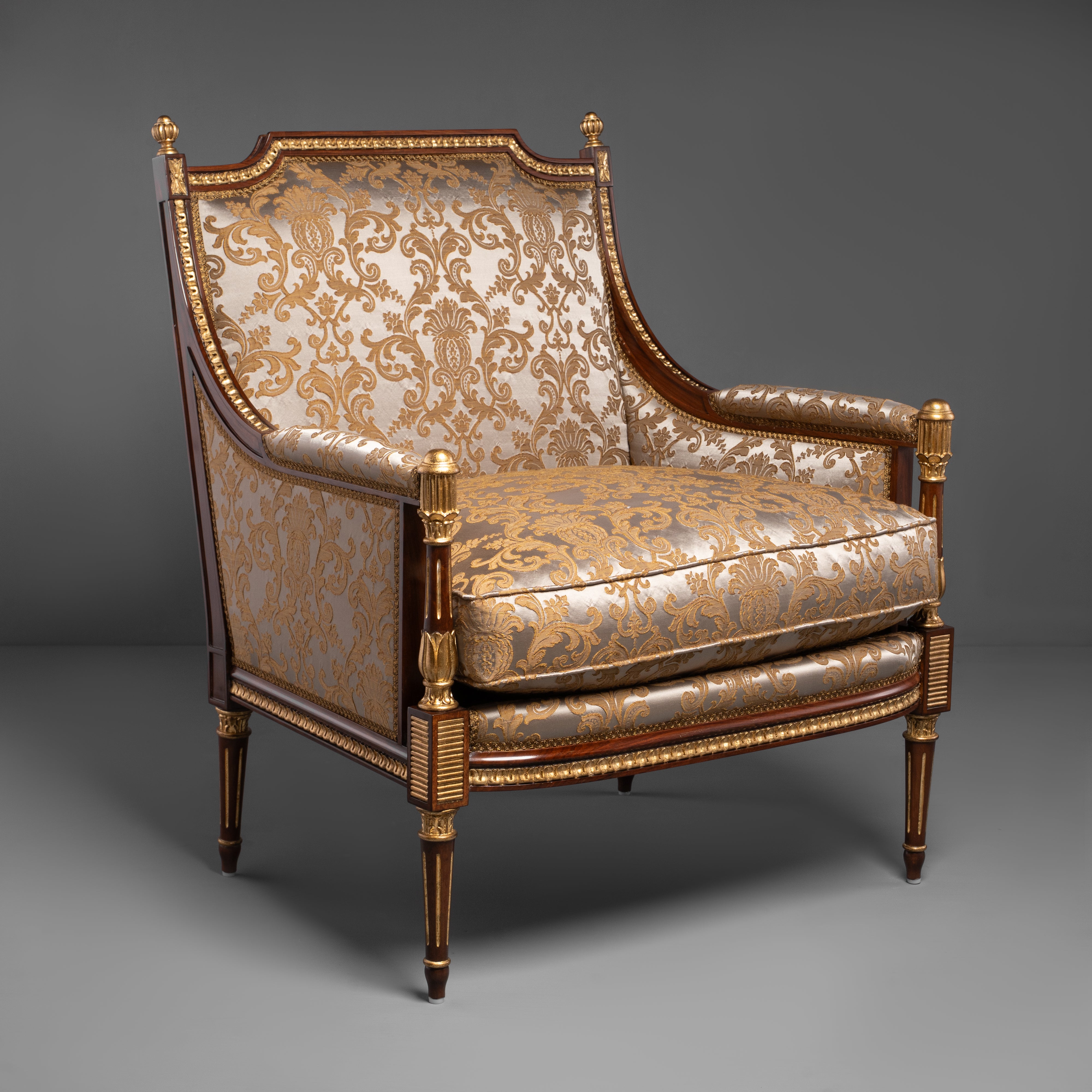 Hand-Carved Louis XVI Style Armchair with Ornate Brass Motifs