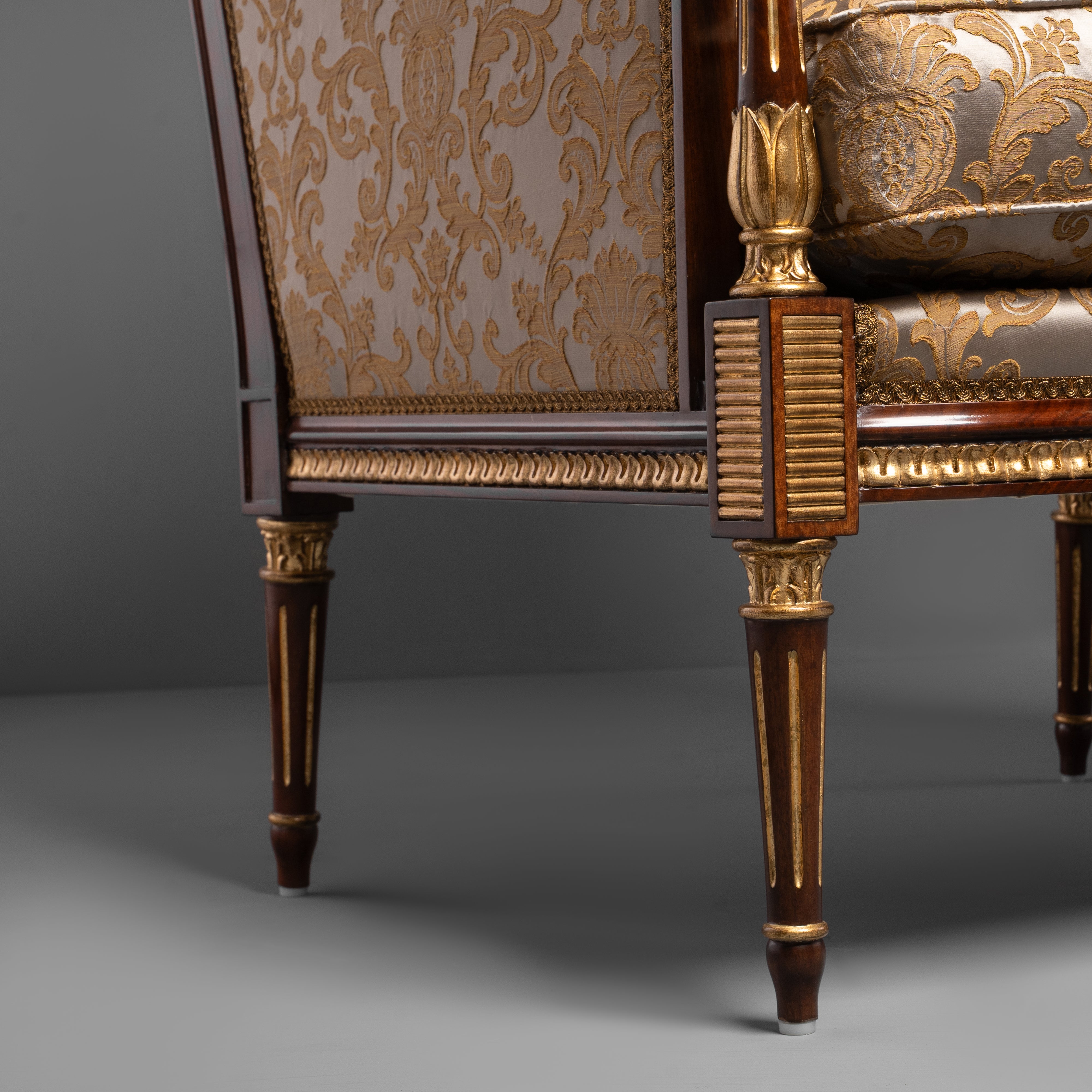 Hand-Carved Louis XVI Style Armchair with Ornate Brass Motifs