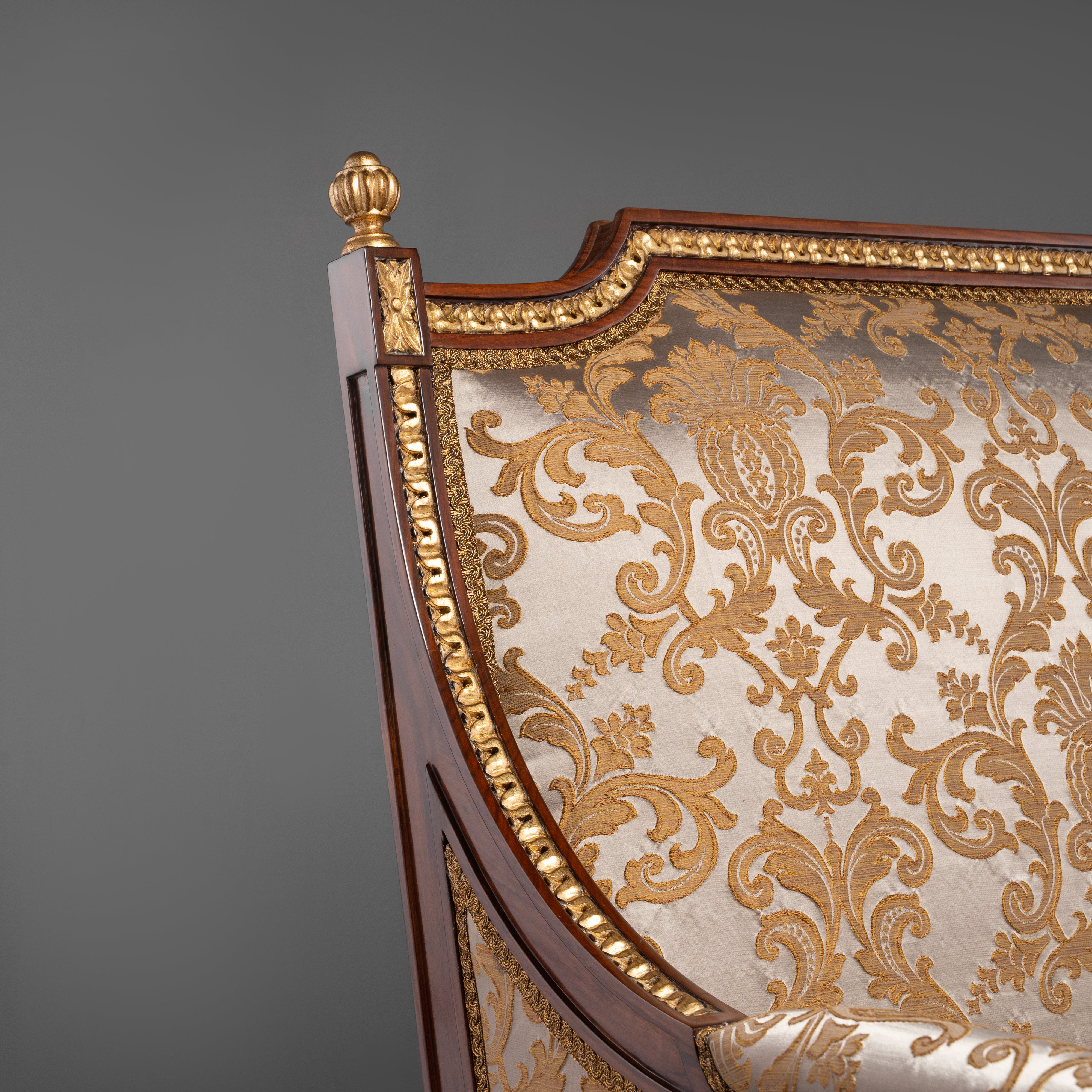 Hand-Carved Louis XVI Style Armchair with Ornate Brass Motifs