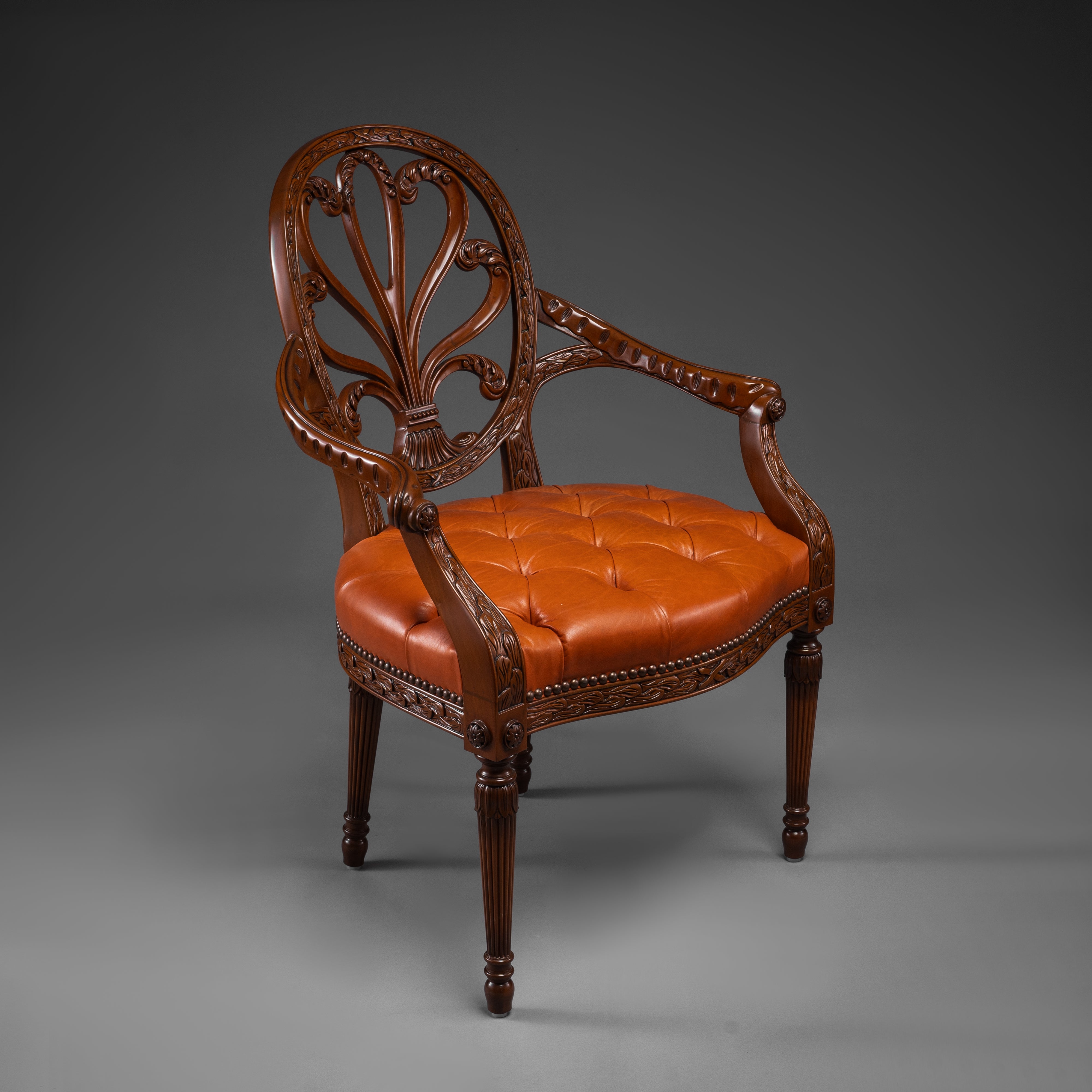 Mahogany Armchair with Carved Fan Back and Tufted Leather Seat