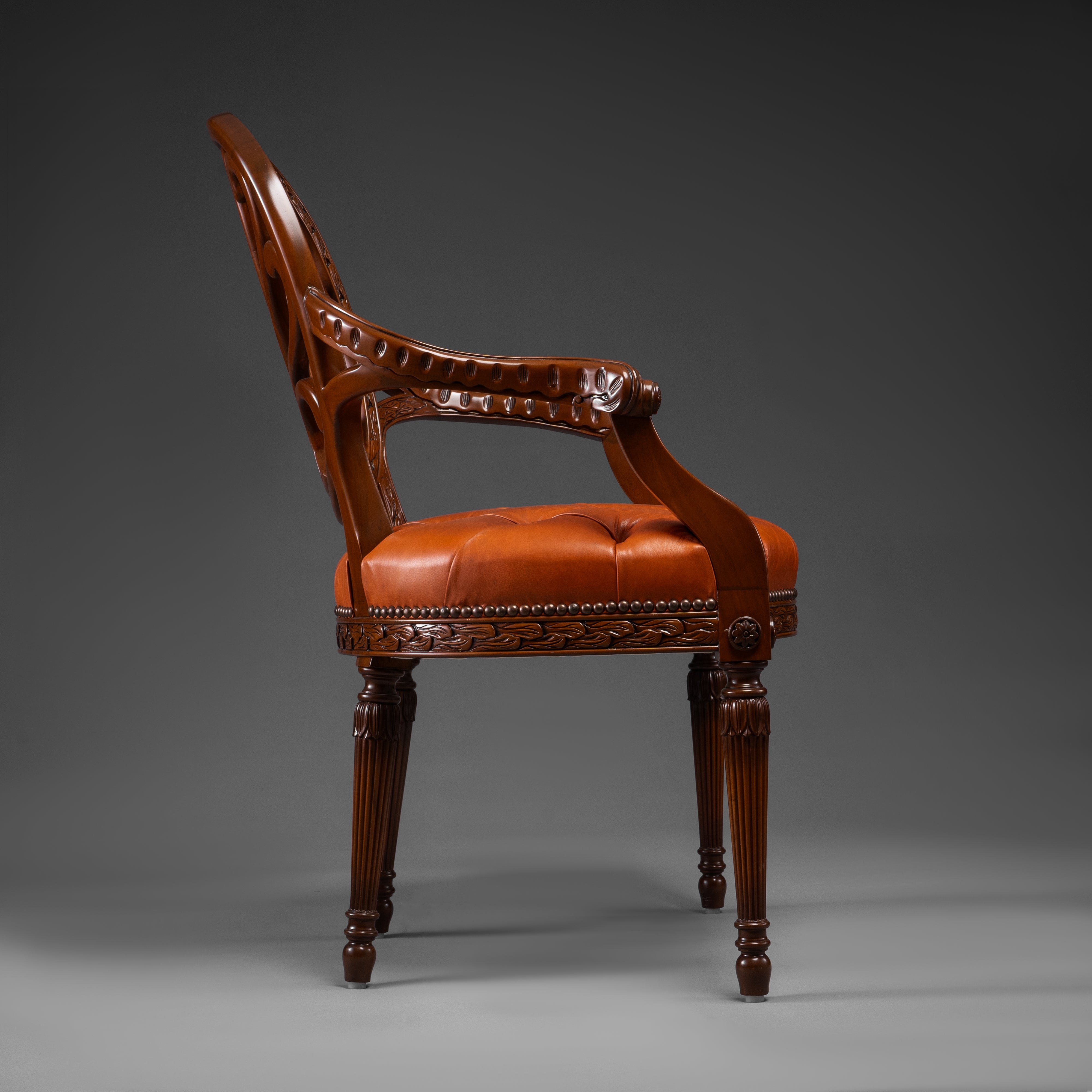 Mahogany Armchair with Carved Fan Back and Tufted Leather Seat