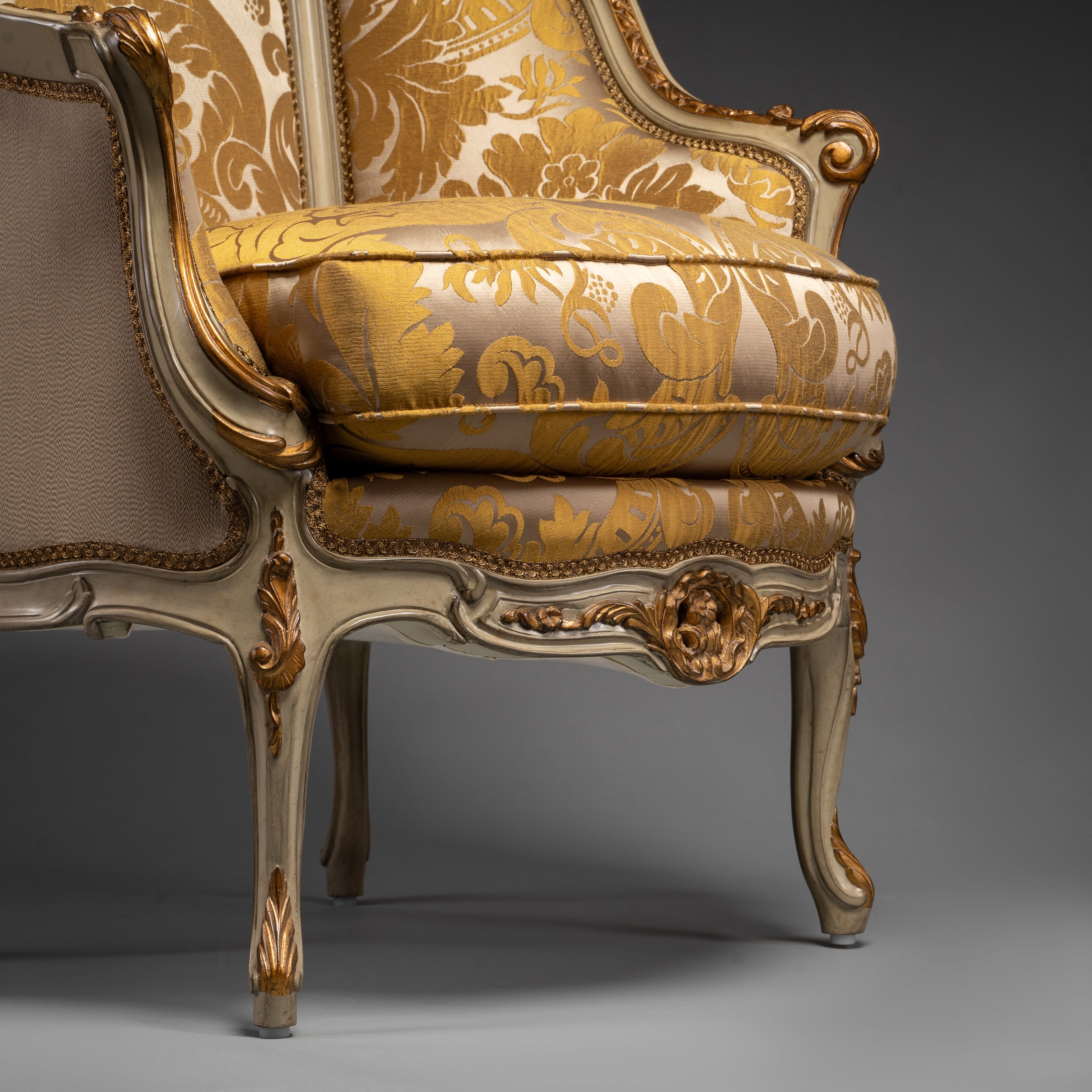 Vintage Louis XV-Style Armchair with Ornate Carvings and Golden Upholstery