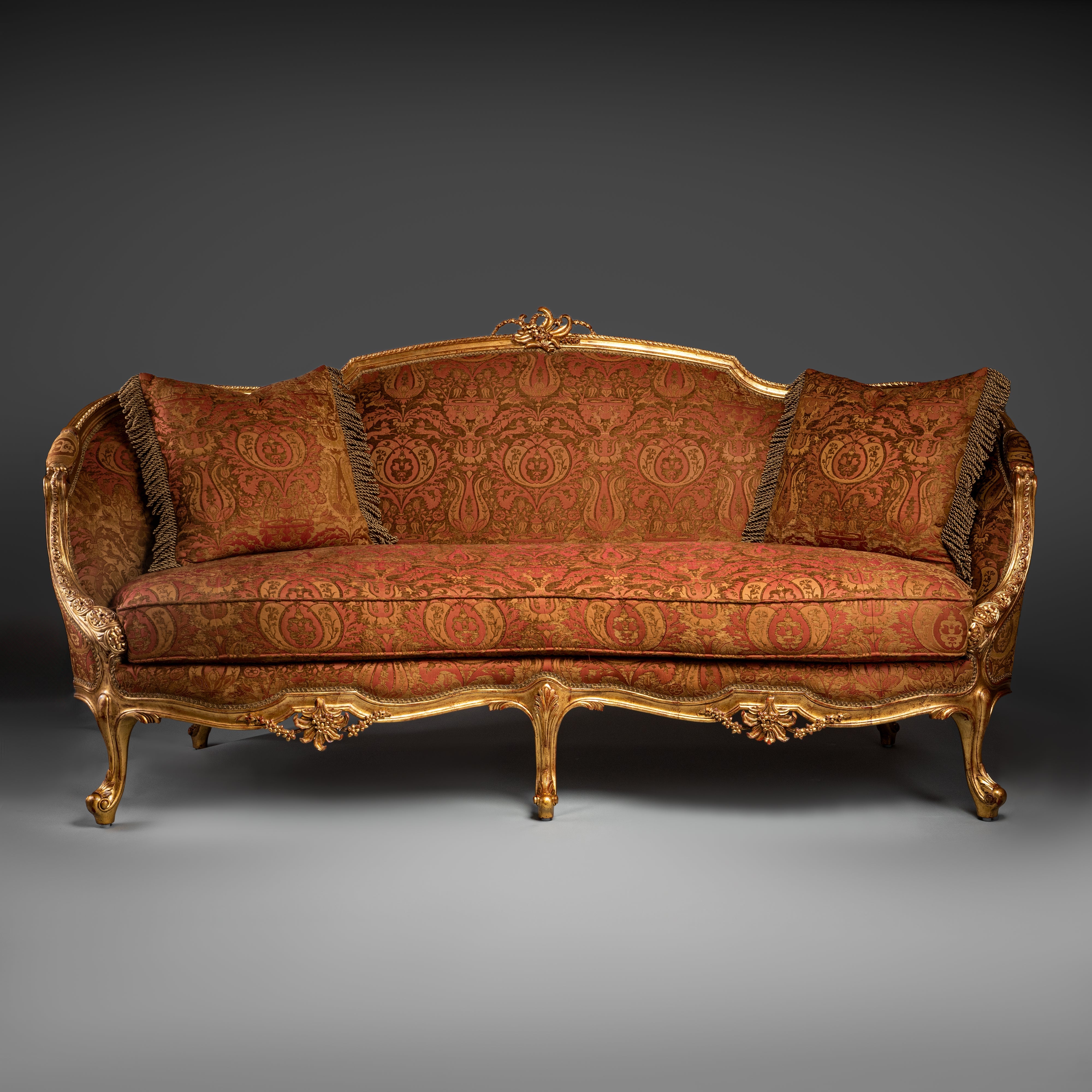 Luxurious Louis XV-Style Sofa with Ornate Gilded Frame and Red Brocade Upholstery