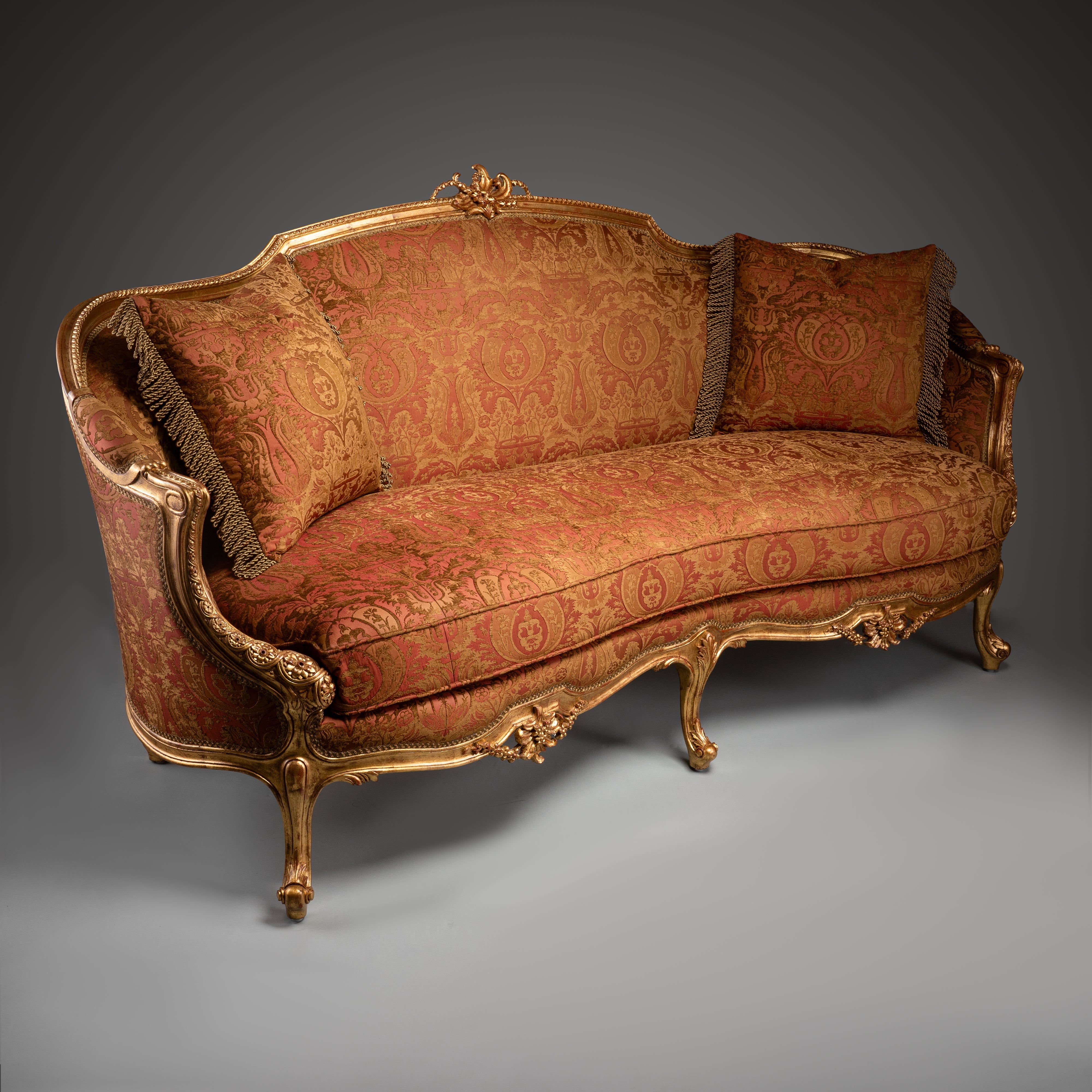 Luxurious Louis XV-Style Sofa with Ornate Gilded Frame and Red Brocade Upholstery