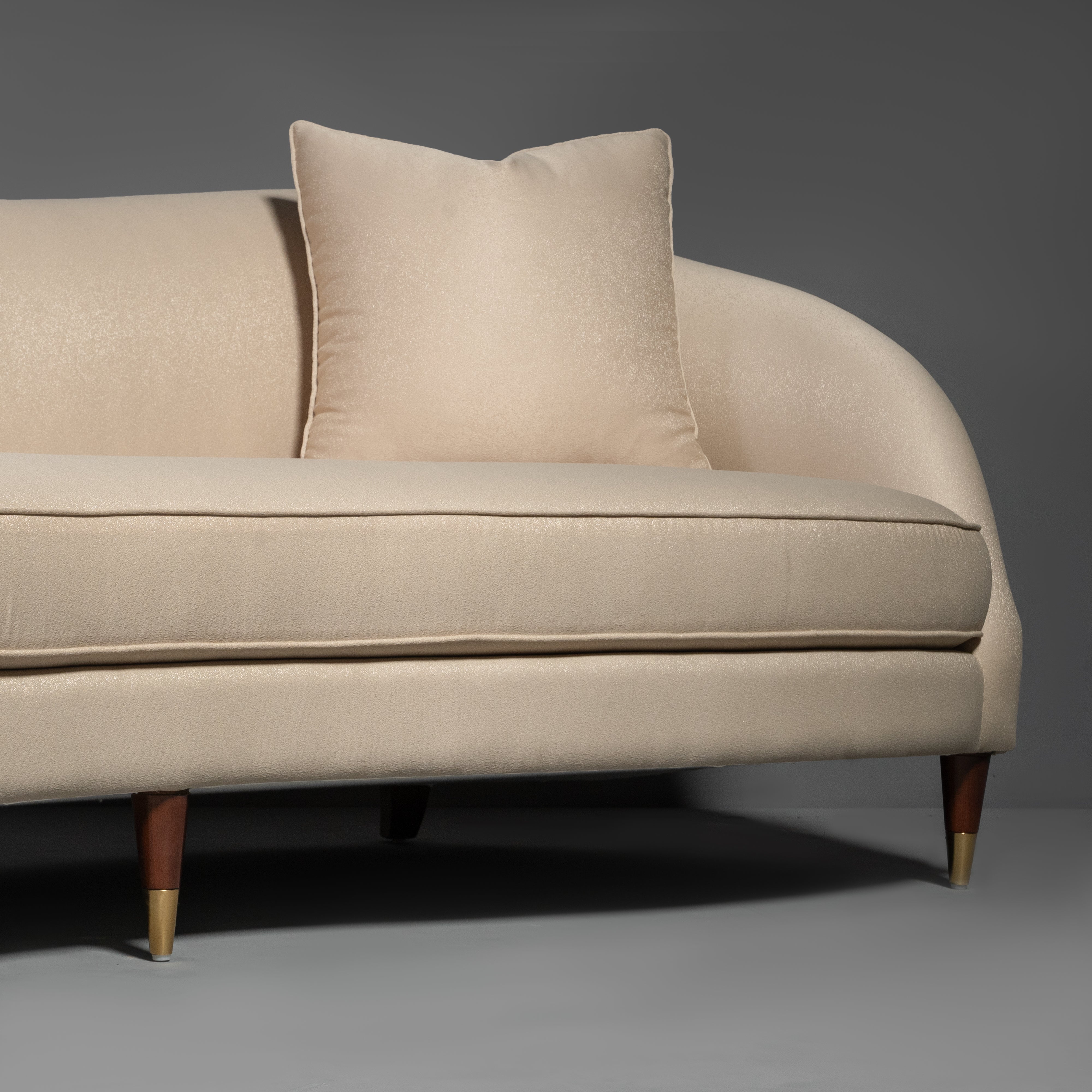 Contemporary Curvilinear Sofa with Tapered Brass Feet