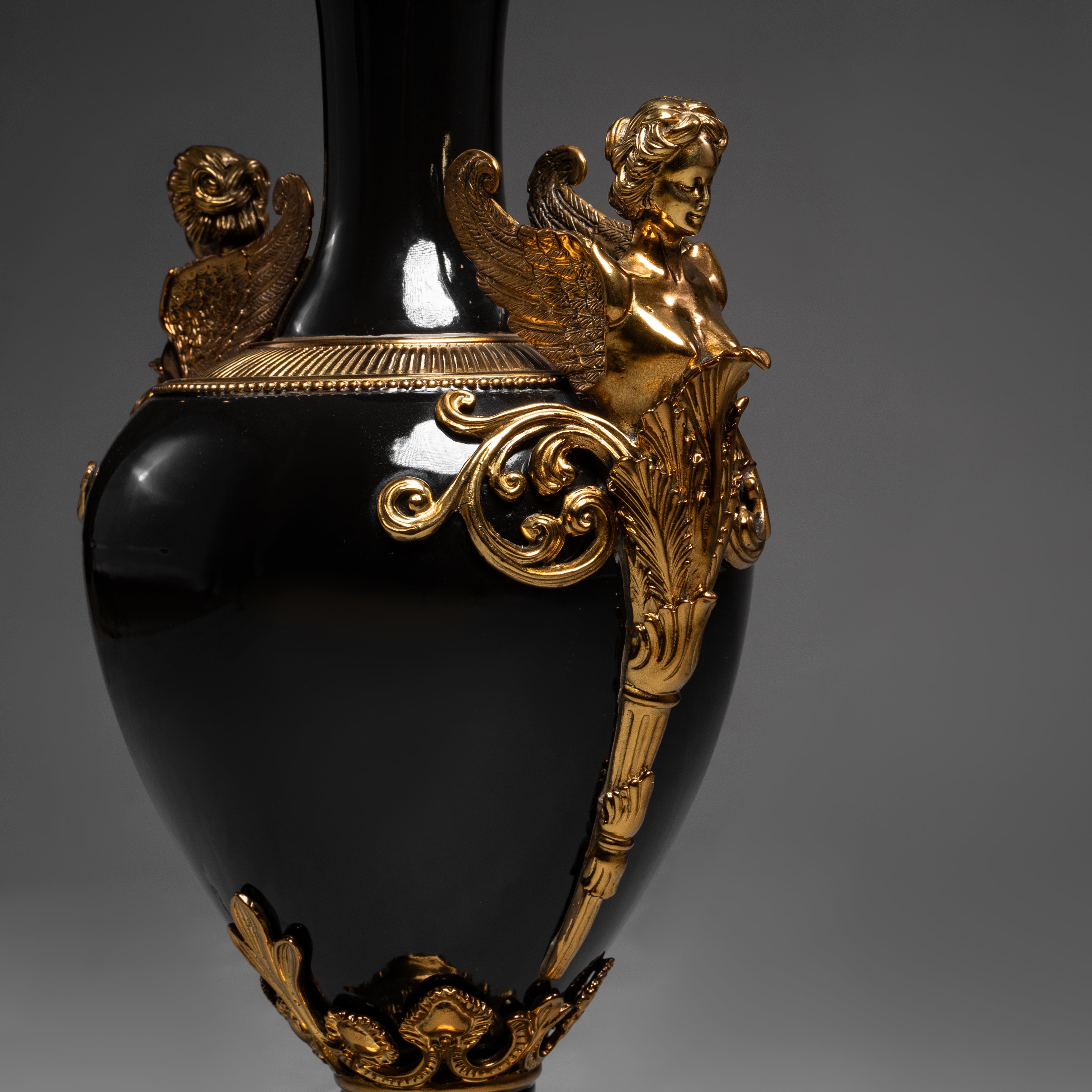 Elegant Black and Gold Neoclassical Vase with Winged Figures