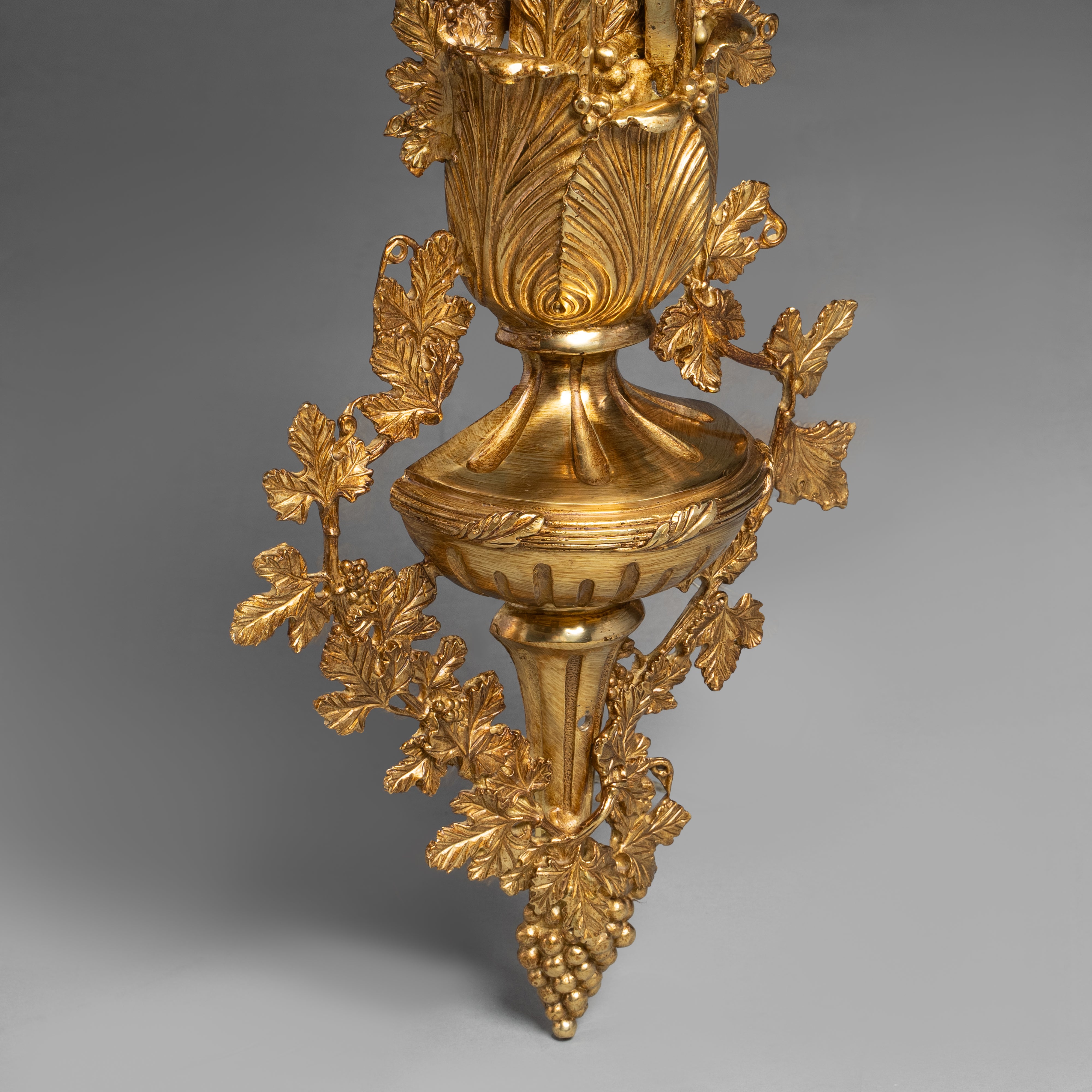 Ornate Louis XVI-style gilt bronze wall sconce  with intricate acanthus and floral motifs