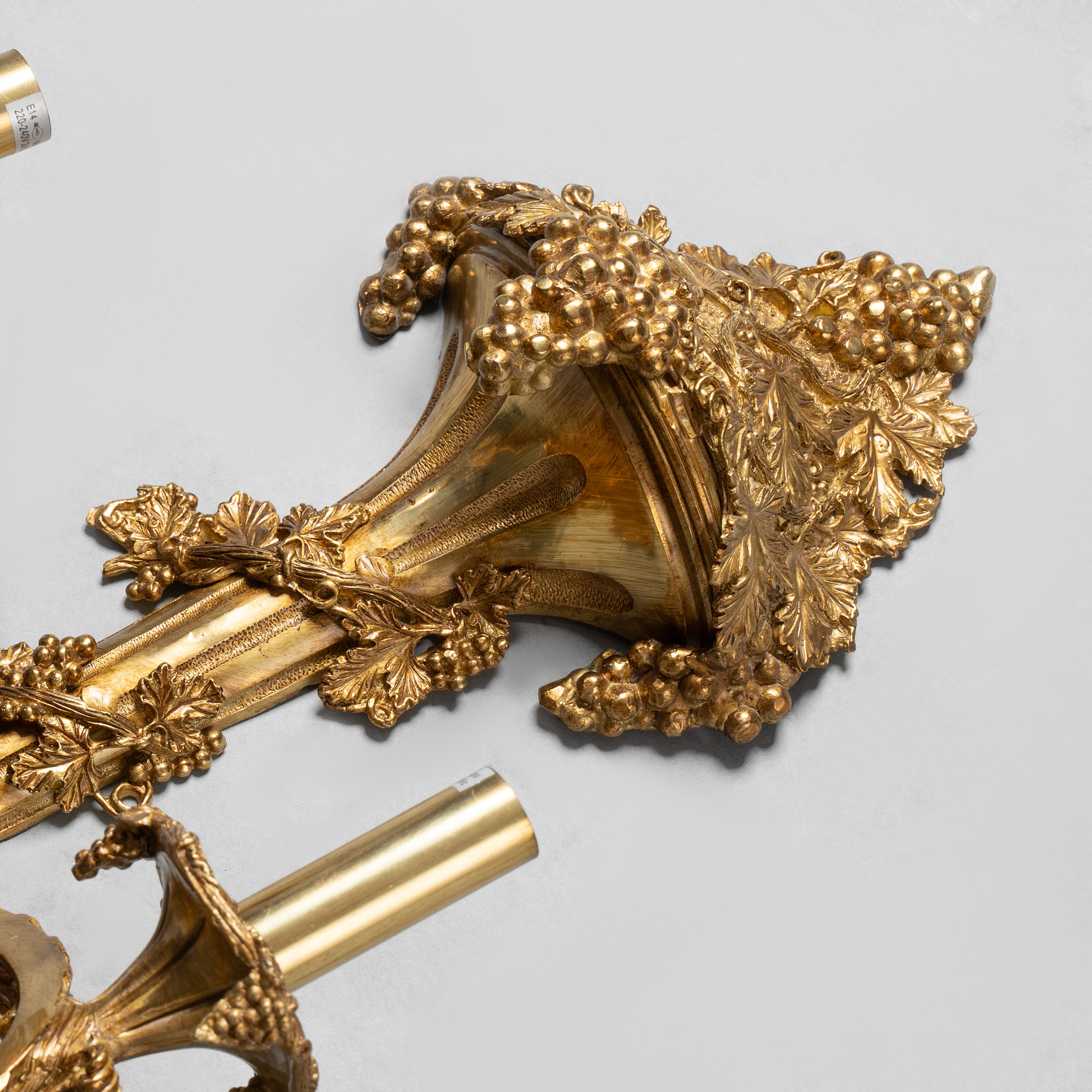 Ornate Louis XVI-style gilt bronze wall sconce  with intricate acanthus and floral motifs
