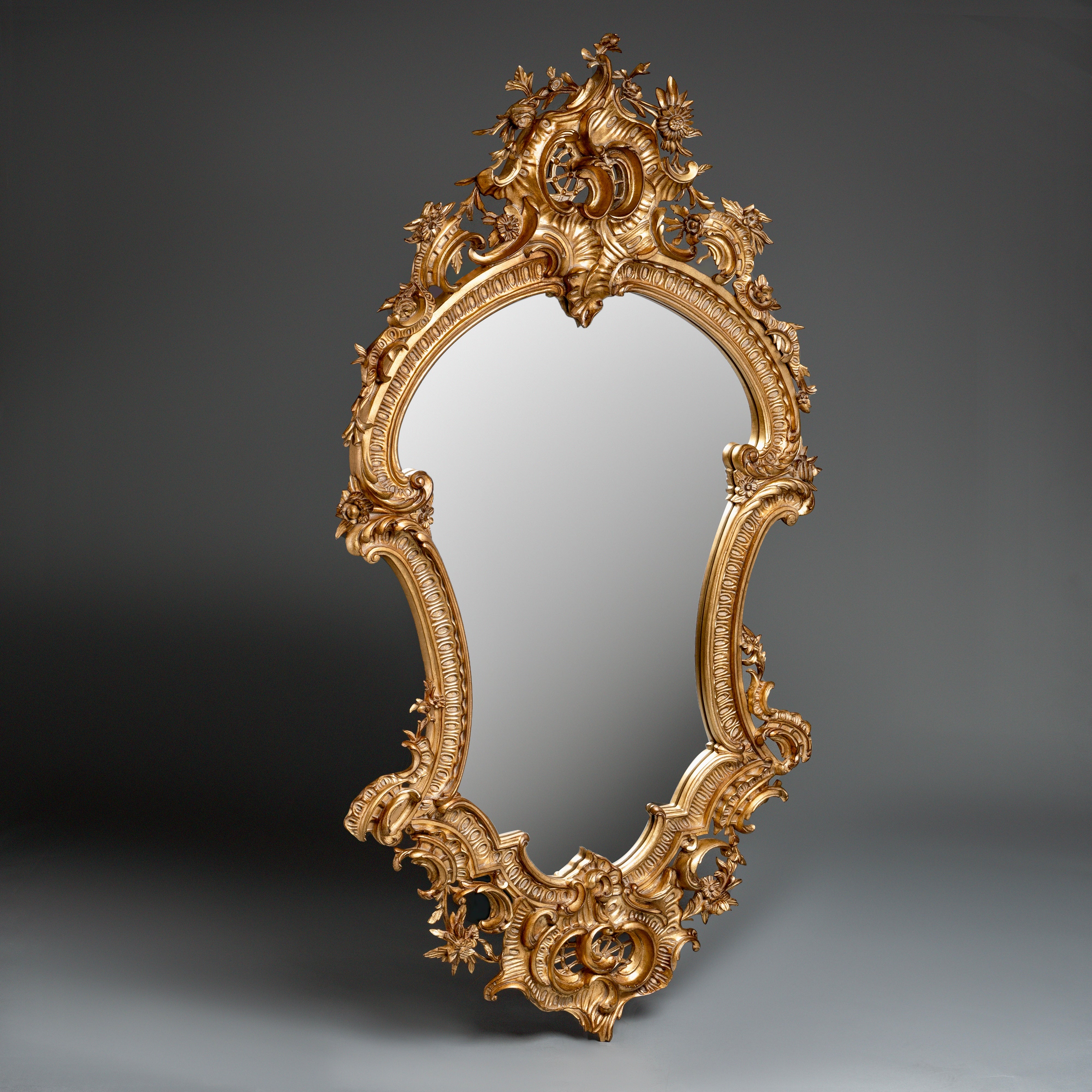 Rococo-Style Ornate Gilded Mirror  with Floral and Scrollwork Detailing