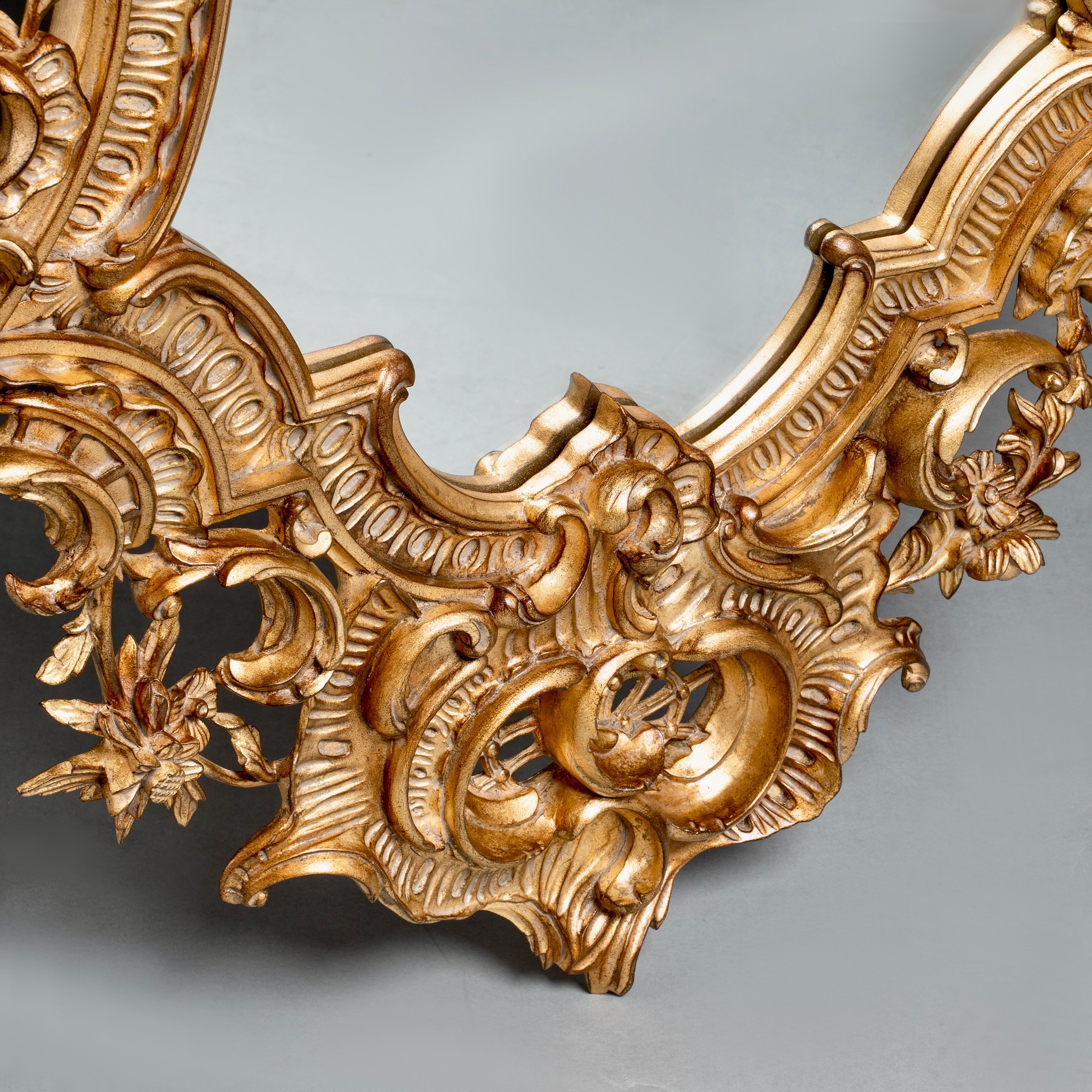 Rococo-Style Ornate Gilded Mirror  with Floral and Scrollwork Detailing