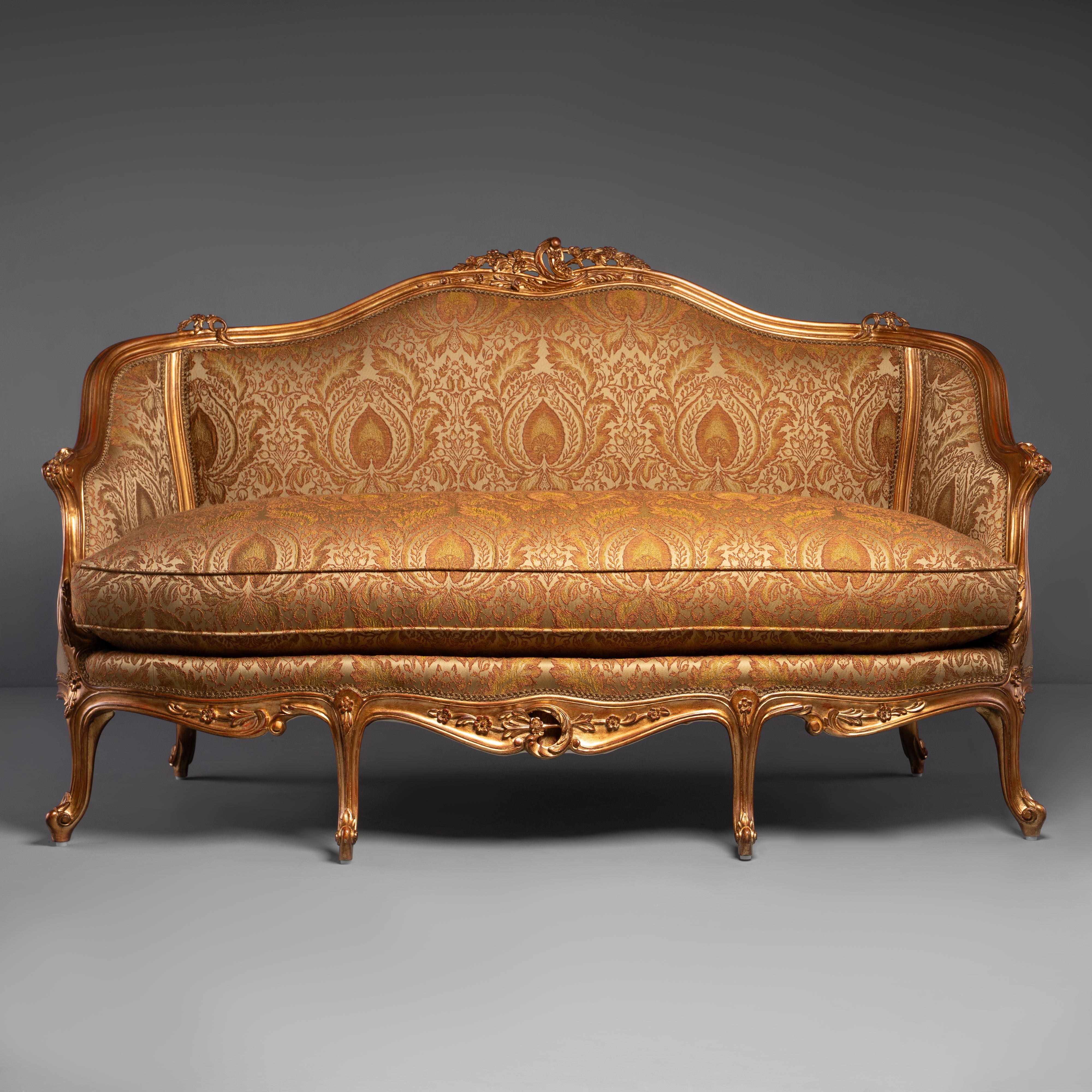 Hand-Carved Rococo Revival Gilt Sofa with Intricate Floral Motifs